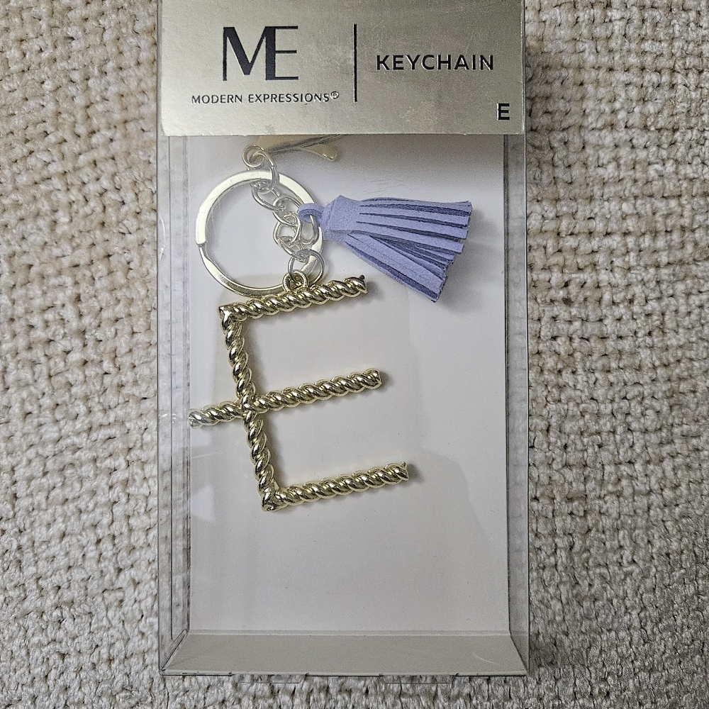 Modern Expressions Gold Keychain with Lavender Tassel. Initial "E"